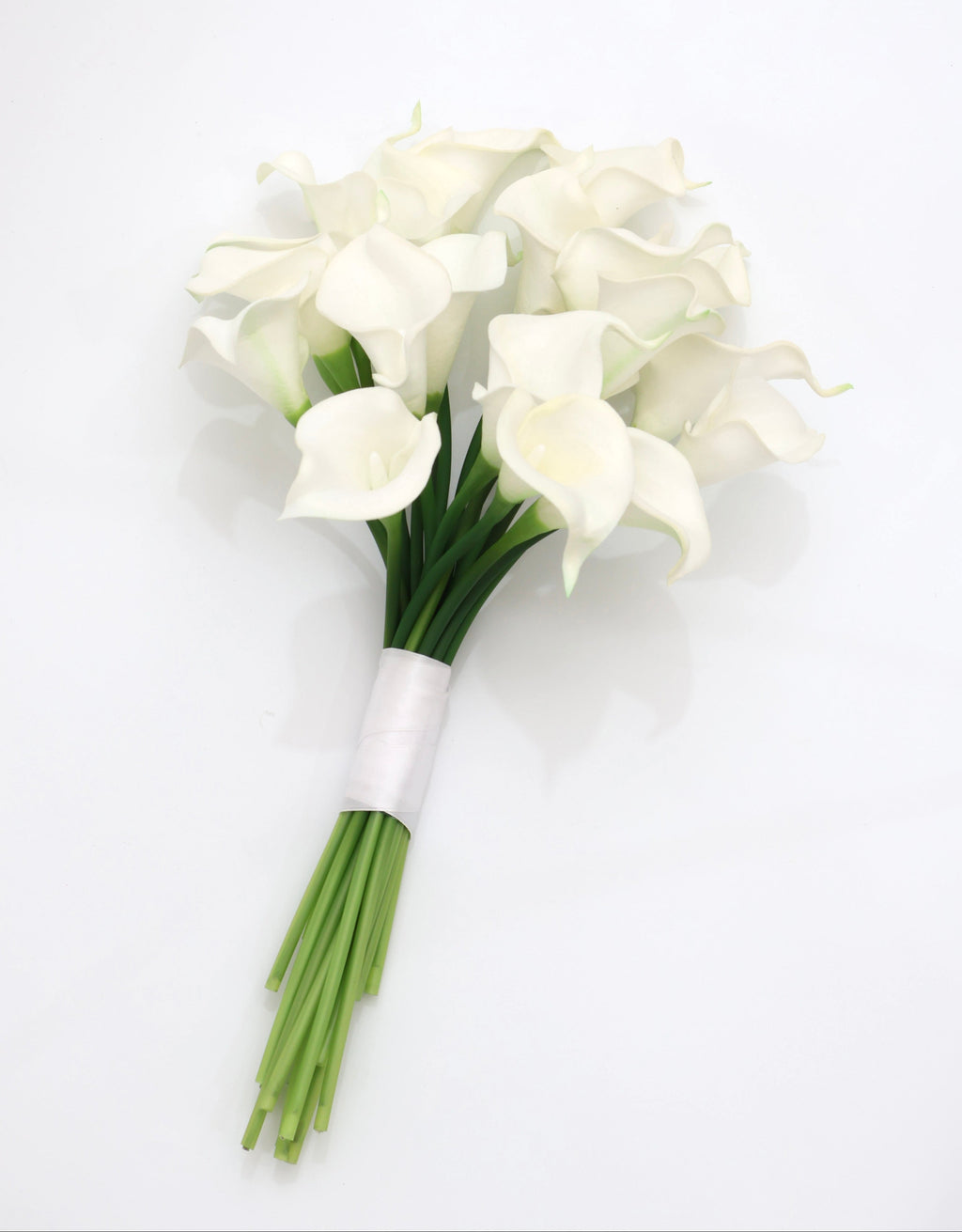 Bouquet of white calla lily flowers with green stems on a white background