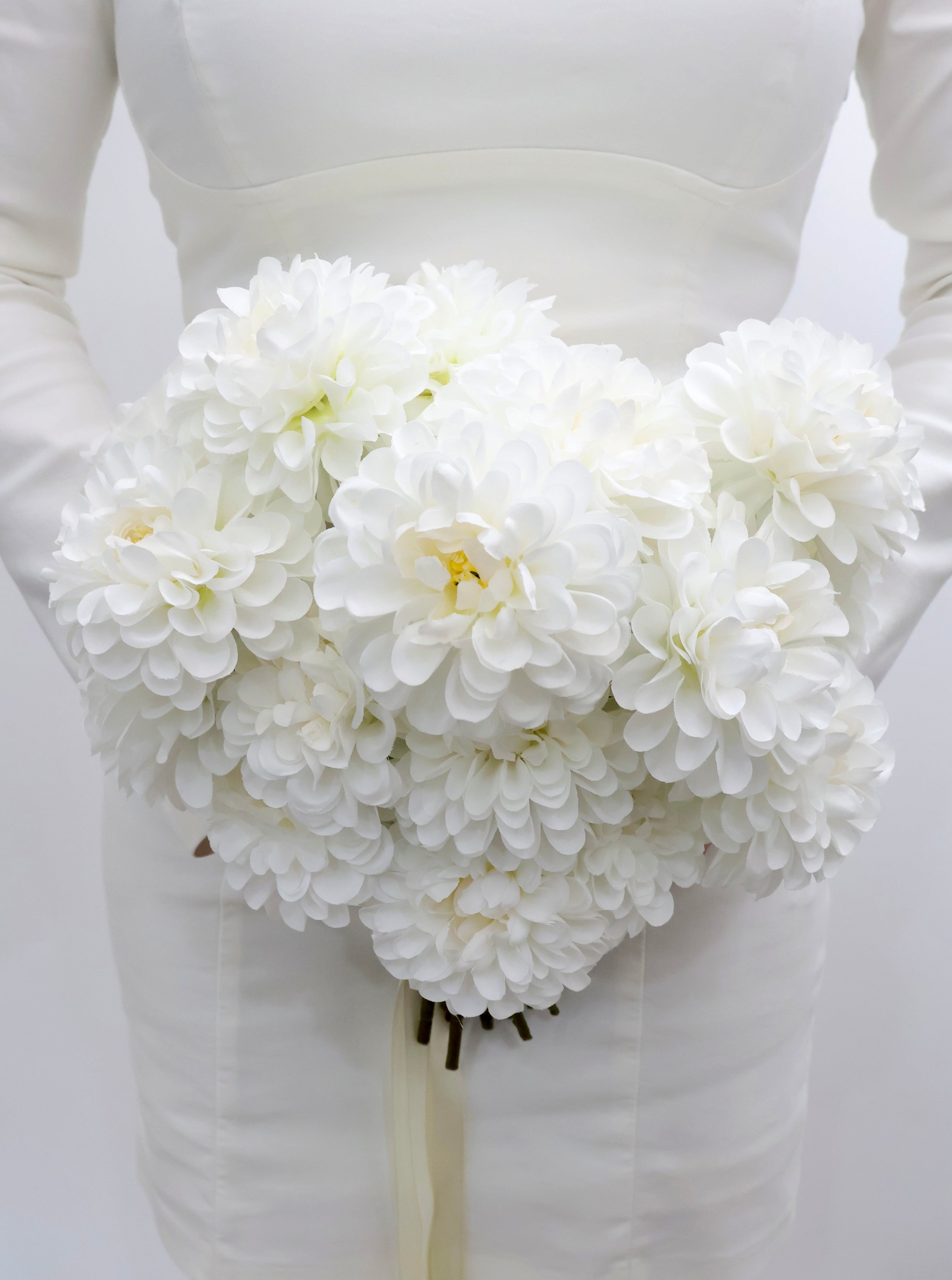 Bouquet of white dahlia bridal bouquet  with a ribbon on a white background