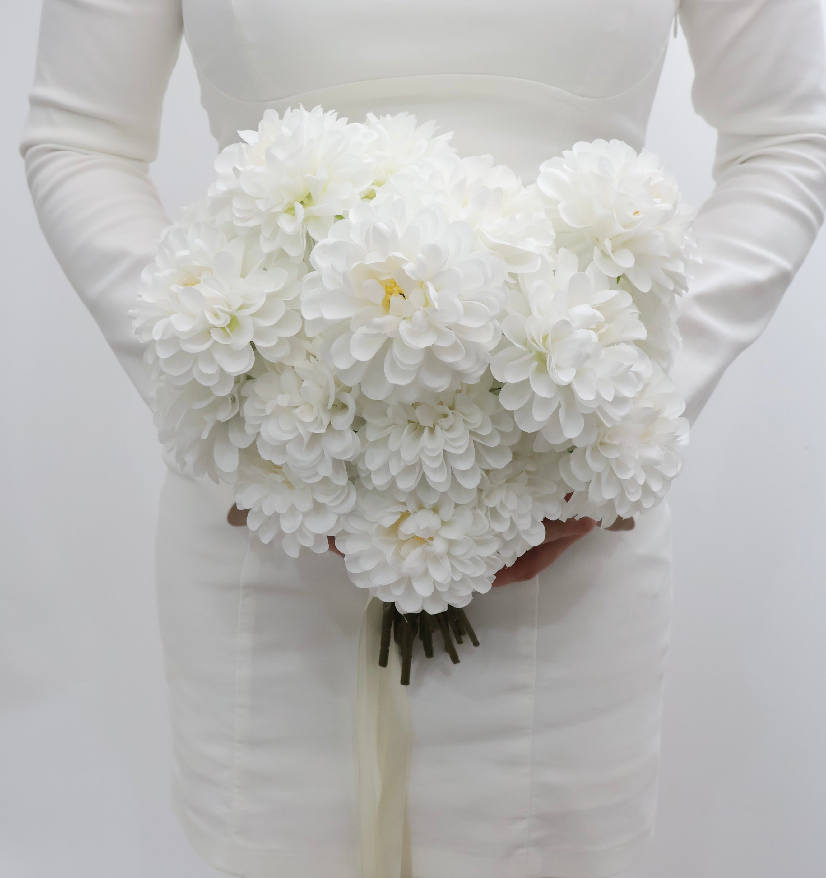 Bouquet of white dahlia bridal bouquet  with a ribbon on a white background