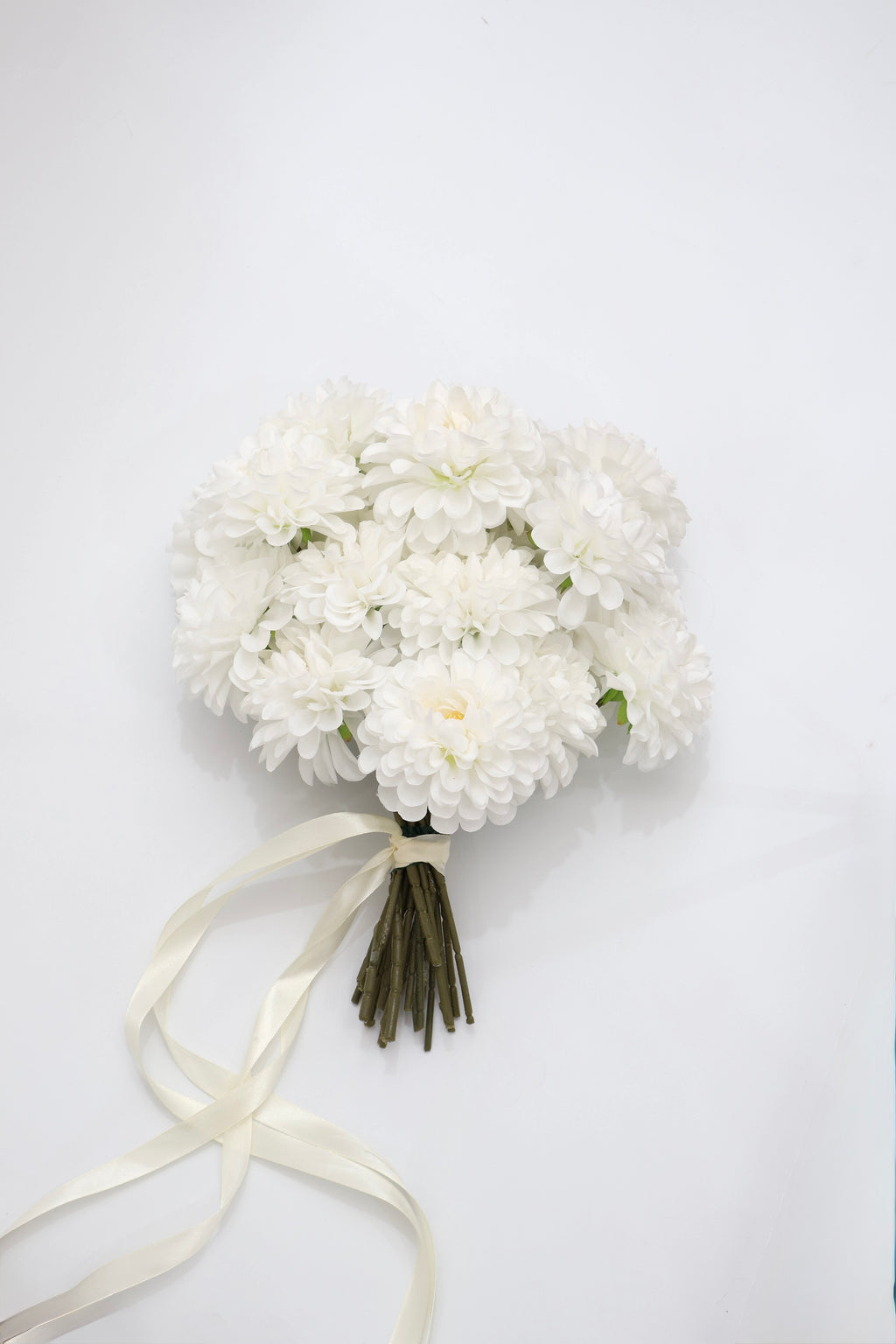 Bouquet of white dahlia bridal bouquet  with a ribbon on a white background
